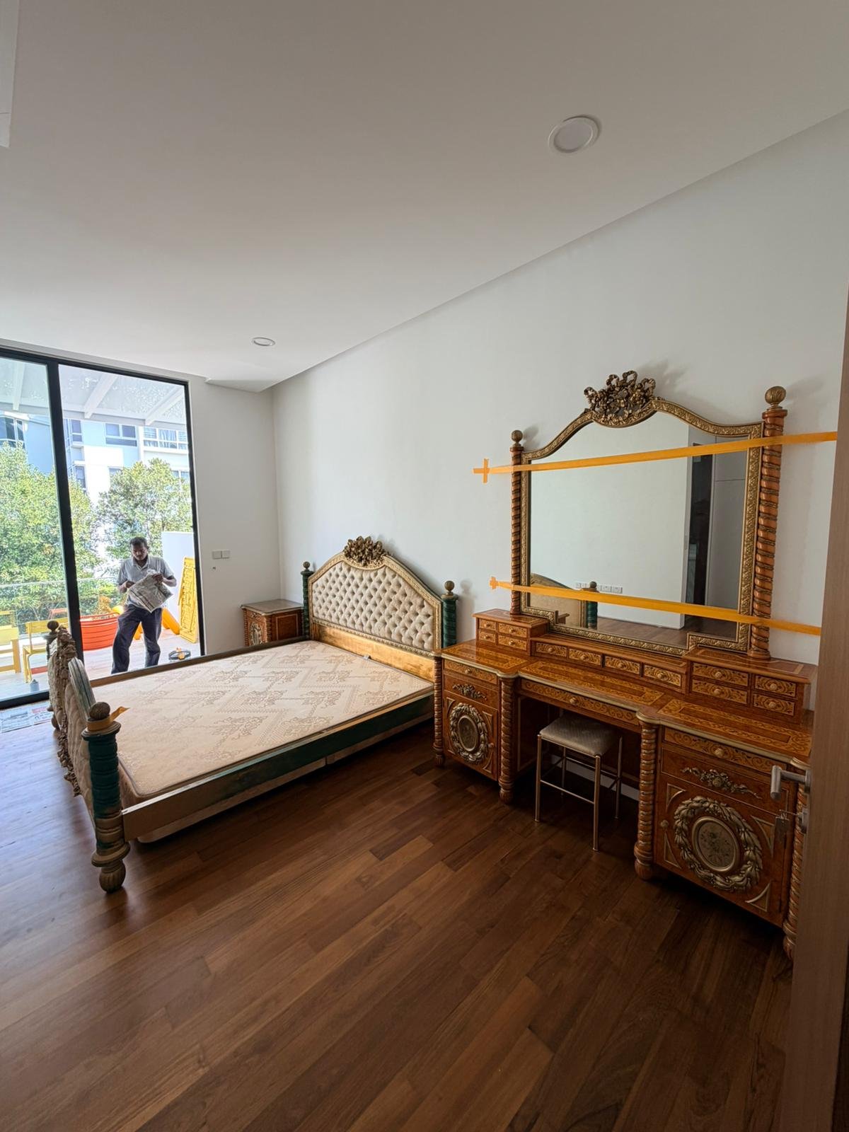 Aspect crew moving wrapped furniture in a Singapore home